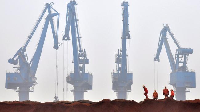 Iron ore is unloaded at a port in China. Picture: Reuters