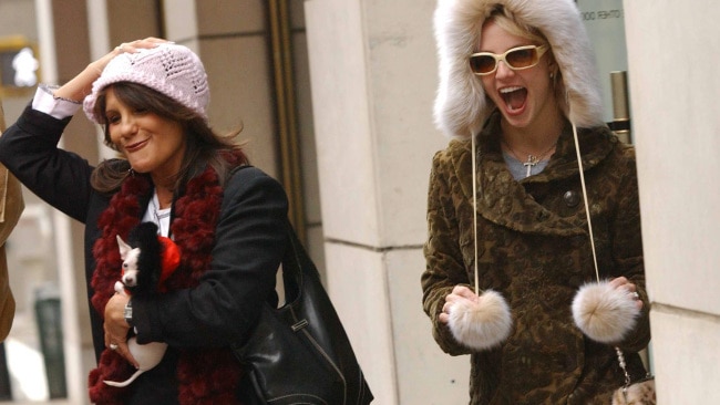 Singer Britney Spears (centre) and her mother Lynne Spears (left) wear the new hats they bought at Barneys New York as they leave the store on December 13, 2004 in New York City. Picture: Getty Images