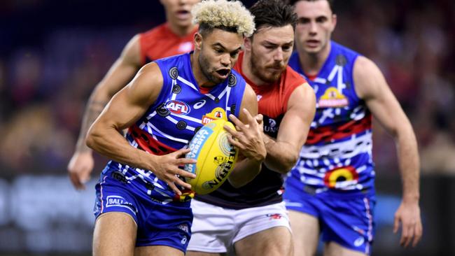 Jason Johannisen is tackled by Michael Hibberd.