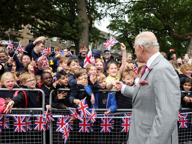 The King greets young fans after a visit to Lancaster Castle. Picture: AFP