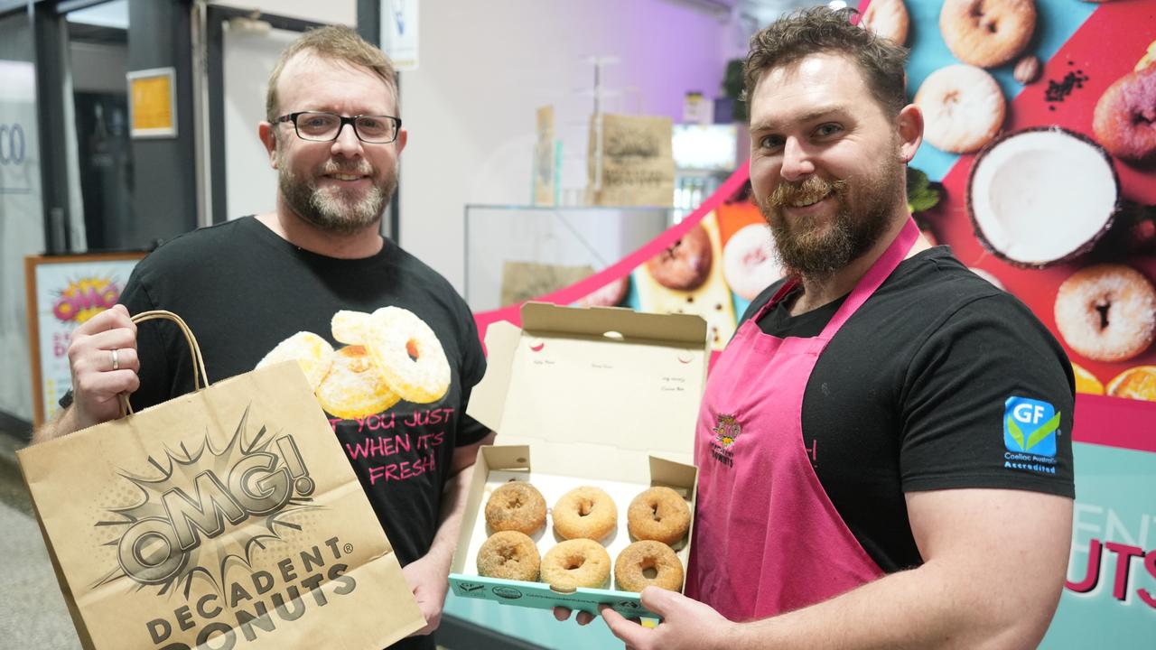 OMG Decadent Donuts Toowoomba franchise owners (from left) Rob Sampson and Robert Gillis celebrate outside their shop in the Australia Arcade after the national company swept the gourmet doughnut category at the Excellence in Baking Awards run by the Baking Association of Australia.