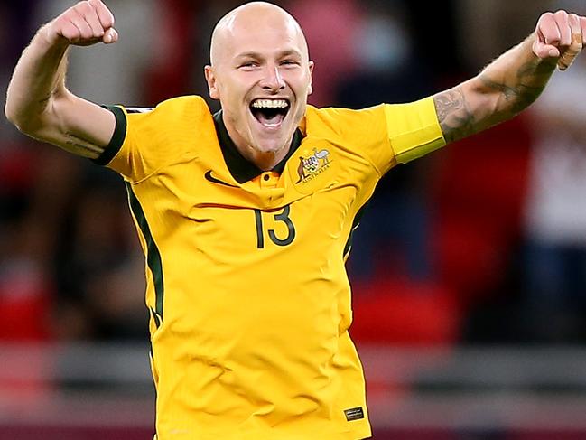 DOHA, QATAR - JUNE 13: Aaron Mooy of Australia celebrates their sides victory after a penalty shoot out following the 2022 FIFA World Cup Playoff match between Australia Socceroos and Peru at Ahmad Bin Ali Stadium on June 13, 2022 in Doha, Qatar. (Photo by Mohamed Farag/Getty Images)