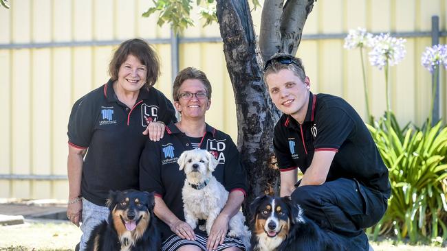 The Lost dogs of Adelaide page prides itself in reuniting lost dogs with their owners. Felicity Henderson of Modbury North with Bella a Maltese cross Shih-tzu, James Kuhn, 27, of South Plympton with dogs, Sasha and Maisie, and Jo Perry, 60, of Semaphore. Picture: AAP/ROY VANDERVEGT