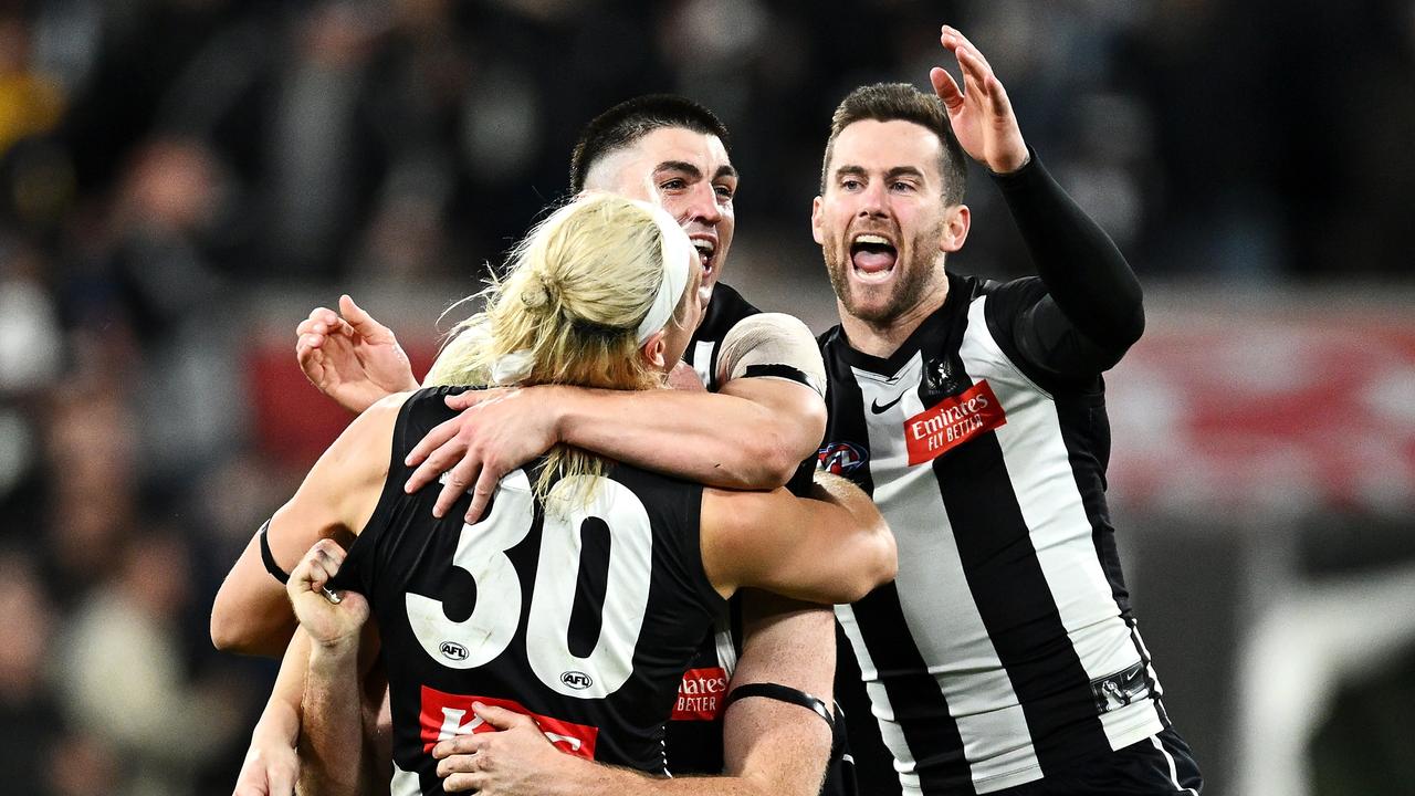 The Magpies celebrate after the nailbiting victory over the Giants. (Photo by Quinn Rooney/Getty Images)