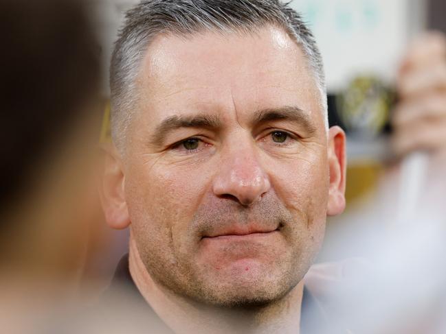 MELBOURNE, AUSTRALIA - AUGUST 24: Adem Yze, Senior Coach of the Tigers addresses his players during the 2024 AFL Round 24 match between the Richmond Tigers and the Gold Coast SUNS at The Melbourne Cricket Ground on August 24, 2024 in Melbourne, Australia. (Photo by Dylan Burns/AFL Photos via Getty Images)