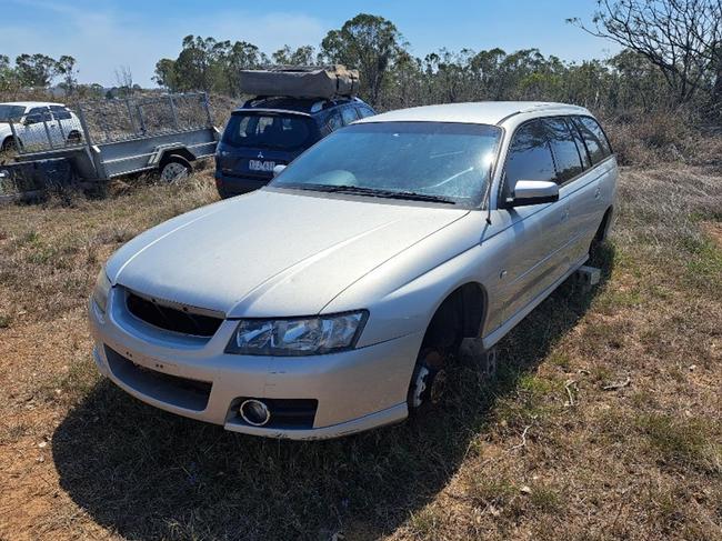 Unregistered, five door wagon, silver Holden Commodore.