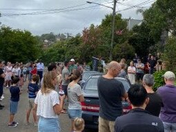 A crowd outside the auction for 18 Chandos St, Manly on Saturday, February 20, 2021. NSW real estate.