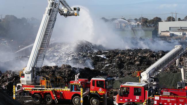 Firefighters continue to fight the Coolaroo recycling plant fire. Picture: David Crosling