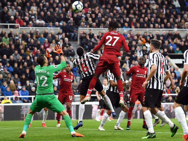 NEWCASTLE UPON TYNE, ENGLAND - MAY 04: Divock Origi of Liverpool scores his team's third goal during the Premier League match between Newcastle United and Liverpool FC at St. James Park on May 04, 2019 in Newcastle upon Tyne, United Kingdom. (Photo by Shaun Botterill/Getty Images)