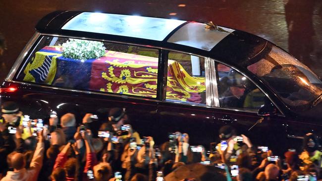 Queen Elizabeth’s coffin is taken in the Royal Hearse to Buckingham Palace. Picture: AFP.