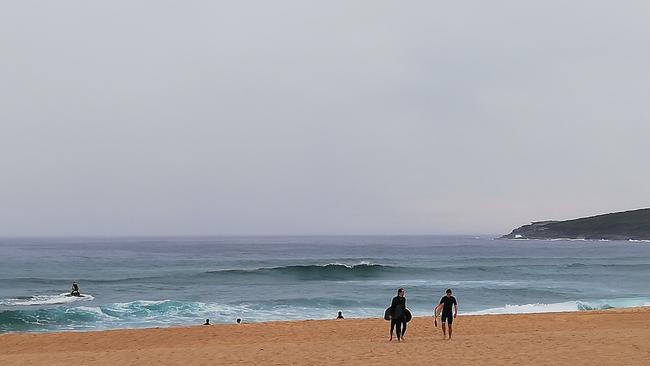 Life guards are assisted by a chopper to look for the sharks and move them on. Picture: Supplied