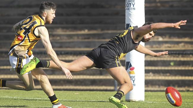 St Paul's Nikolas Papaioannou and Mawson Lakes’ Andrew Haydon in action during the grand final. Picture: AAP/Dean Martin