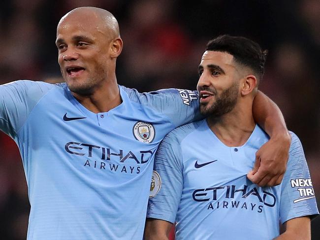 BOURNEMOUTH, ENGLAND - MARCH 02: Vincent Kompany of Manchester City celebrates with teammate Riyad Mahrez of Manchester City following the Premier League match between AFC Bournemouth and Manchester City at Vitality Stadium on March 02, 2019 in Bournemouth, United Kingdom. (Photo by Richard Heathcote/Getty Images)