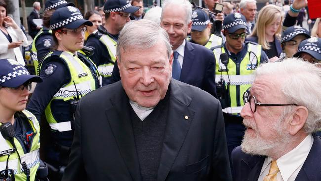 Cardinal George Pell leaves the Melbourne Magistrates' Court with a heavy Police escort in 2017. Picture: Getty Images