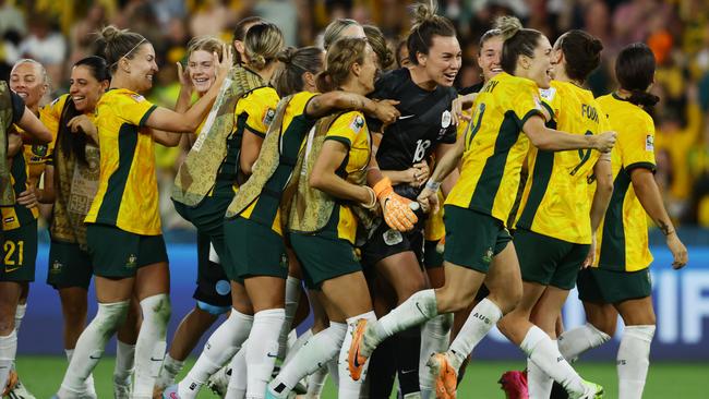 Matildas players celebrate winning the FIFA Womens World Cup Quarter final match between against France at Brisbane Stadium. Picture Lachie Millard