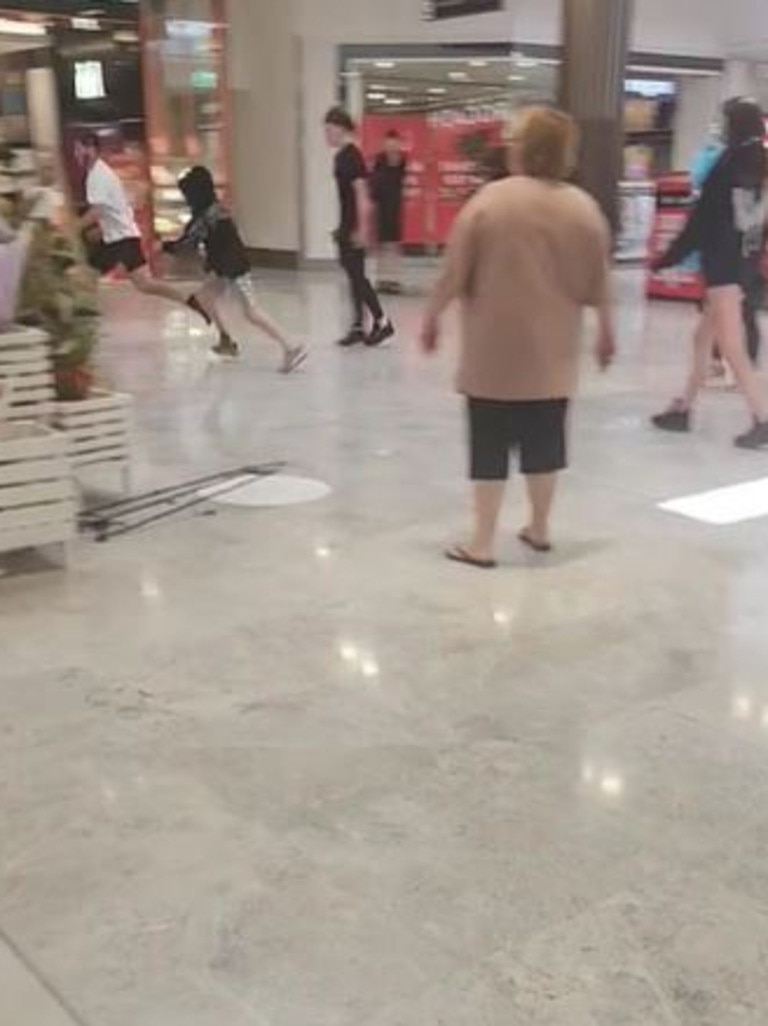 A fight between youths at Tea Tree Plaza spills over into the Mimco store. Picture: TikTok / huri640