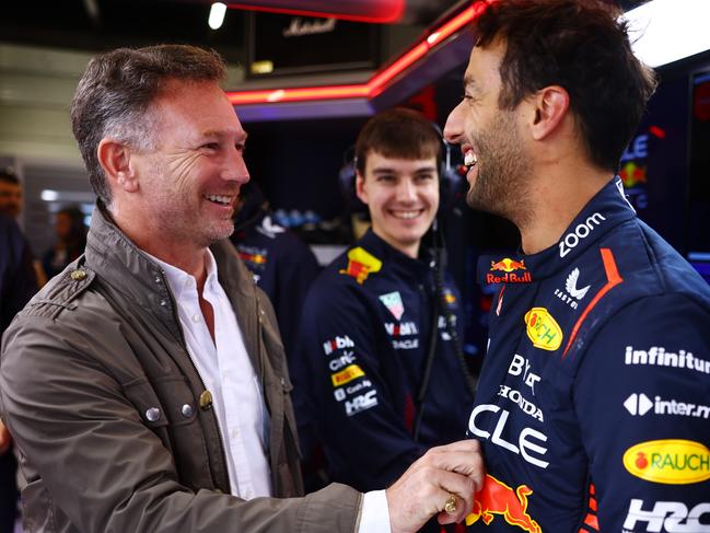 NORTHAMPTON, ENGLAND - JULY 11:  Daniel Ricciardo of Australia and Oracle Red Bull Racing speaks with Red Bull Racing Team Principal Christian Horner as he prepares to drive during Formula 1 testing at Silverstone Circuit on July 11, 2023 in Northampton, England. (Photo by Mark Thompson/Getty Images)