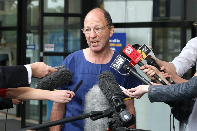 <p>Plastic surgeon Tony Holmes talks to the media before returning to the theatre on the day of the operation. Picture: David Caird</p>