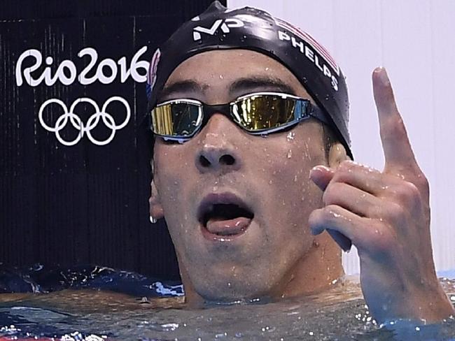 USA's Michael Phelps celebrates after winning the Men's 200m Butterfly Final during the swimming event at the Rio 2016 Olympic Games at the Olympic Aquatics Stadium in Rio de Janeiro on August 9, 2016. / AFP PHOTO / GABRIEL BOUYS