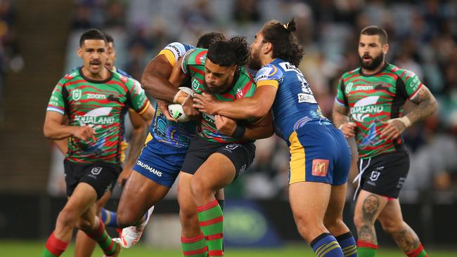 SYDNEY, AUSTRALIA - MAY 29: Keaon Koloamatangi of the Rabbitohs tackled during the round 12 NRL match between the South Sydney Rabbitohs and the Parramatta Eels at Stadium Australia, on May 29, 2021, in Sydney, Australia. (Photo by Jason McCawley/Getty Images)