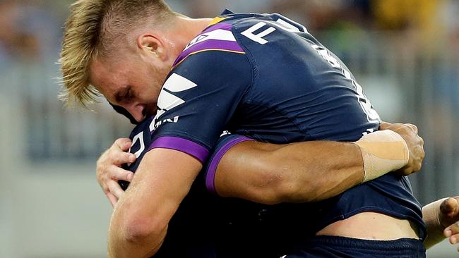 Cameron Munster celebrates a Storm try.