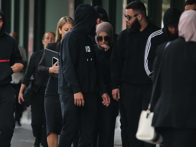 SYDNEY, AUSTRALIA : NewsWire Photos - MARCH 19 2025; Sarah Abu Lebdeh arrives at Downing Court surrounded by friends. One of two Sydney nurses who have been charged after allegedly making anti-Semitic threats in a video filmed at a hospital and widely shared online. Picture: NewsWire/ Gaye Gerard