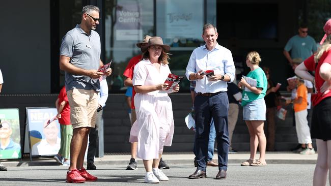 Labor candidate for Leichhardt Matt Smith and ALP Senator Nita Green hand out how to vote cards for the federal election with Treasurer Jim Chalmers at the Australian Electoral Commission pre polling centre set up at the Tjapakai Cultural Park in Smithfield, a northern suburb of Cairns. Picture: Brendan Radke