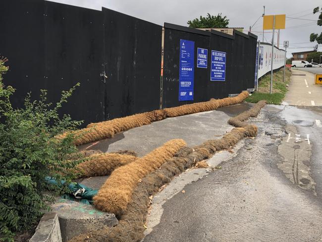 Measures in place on the Allambie Rd edge of the high school site on Friday to prevent run-off incidents. Picture: Jim O’Rourke