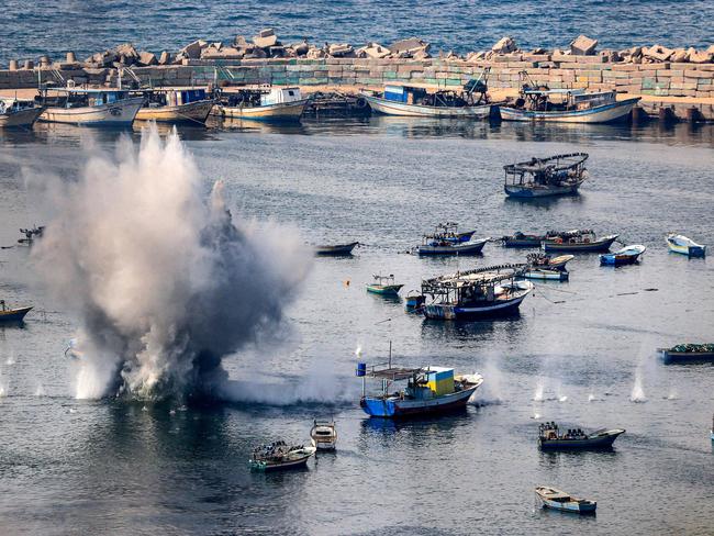 Shells from Israeli bombardment land in the water in the Gaza City seaport. Picture: AFP