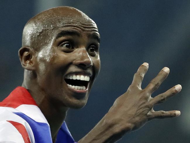 Britain's Mo Farah celebrates winning the gold medal in the men's 5000-meter final during the athletics competitions of the 2016 Summer Olympics at the Olympic stadium in Rio de Janeiro, Brazil, Saturday, Aug. 20, 2016. (AP Photo/Charlie Riedel)