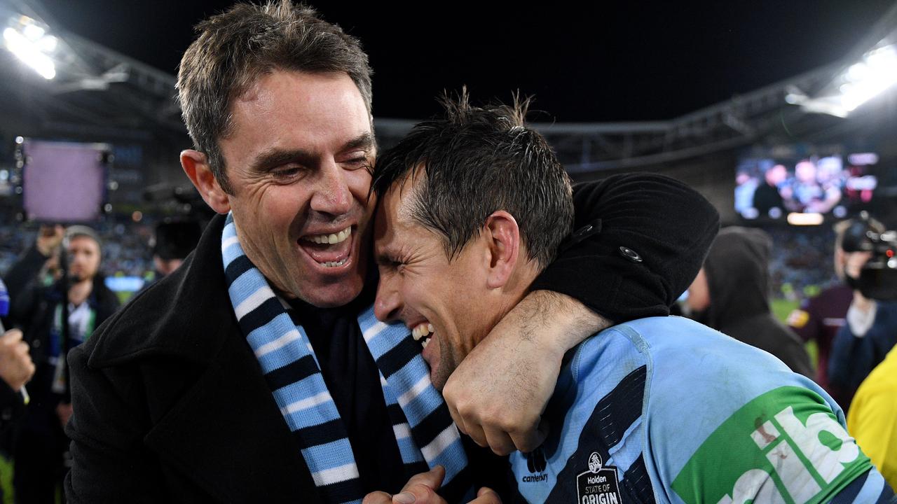 NSW Blues coach Brad Fittler celebrates with Mitchell Pearce.