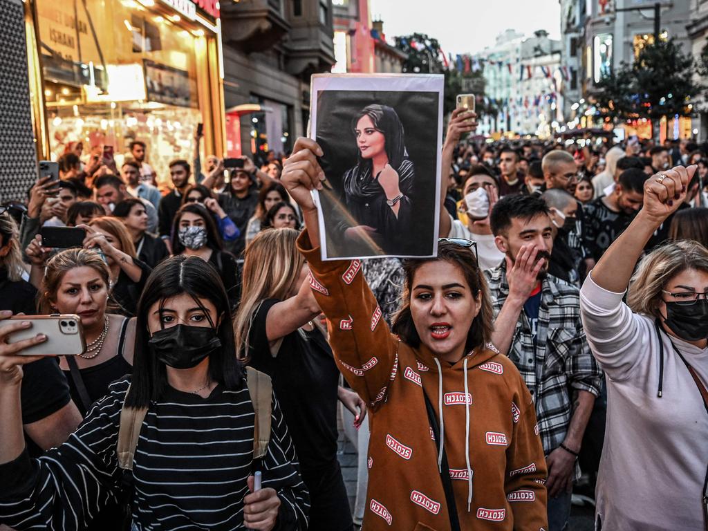 A protester holds a portrait of Mahsa Amini during a protest in Istanbul, Turkey Picture: Ozan Kose/AFP