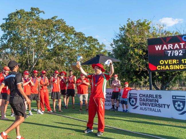 Waratah captain Isaac Conway holds the winners’ trophy aloft after the Darwin T20 cricket final between the Warriors and Southern Districts in June. Picture: CHE CHORLEY