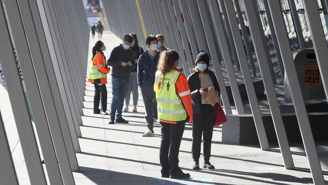 People head to the Melbourne Convention Centre to get their jab. Picture: David Crosling