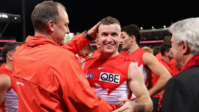 SYDNEY, AUSTRALIA - SEPTEMBER 20: John Longmire, Senior Coach of the Swans and Chad Warner of the Swans celebrate after winning the AFL Preliminary Final match between Sydney Swans and Port Adelaide Power at Sydney Cricket Ground, on September 20, 2024, in Sydney, Australia. (Photo by Cameron Spencer/Getty Images)