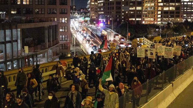 The not-guilty verdict sparked protests across the US. Demonstrators march on the Brooklyn Bridge. Picture: Yuki Iwamura/AFP