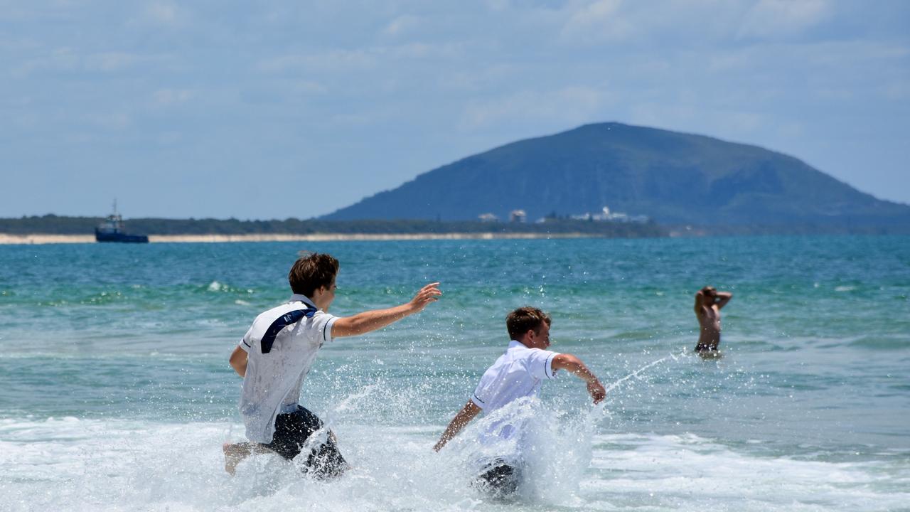 Year 12 graduates from schools across the Sunshine Coast hit to the water at Mooloolaba Beach to celebrate the end of their schooling. Photo: Mark Furler