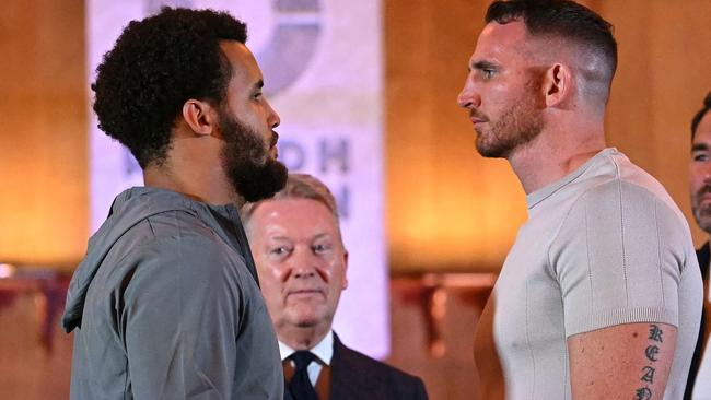 British Slovakian Boxer Moses Itauma (L) and Australian boxer Demsey McKean challenge each other during a press conference, in central London, on October 23, 2024, ahead of their  heavyweight undercard fight, taking place on December 21, 2024 in Riyadh, Saudi Arabia. (Photo by JUSTIN TALLIS / AFP)