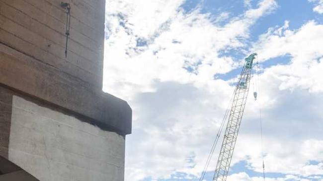 A large crane is framed by the current Grafton bridge on the new development. Picture: Adam Hourigan