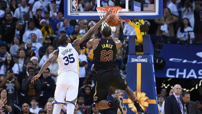 Golden State’s Kevin Durant,  No 35, blocks LeBron James at Oracle Arena