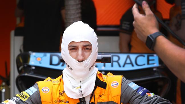 Ricciardo slides into his seat of his car for practice session two at Albert Park. Picture: David Caird