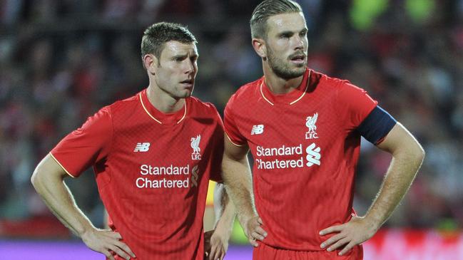 Jordan Henderson and James Milner of Liverpool look on during the international friendly football match between Adelaide United and English Premier League side Liverpool in Adelaide on July 20, 2015. AFP PHOTO / David MARIUZ -- IMAGE STRICTLY RESTRICTED TO EDITORIAL USE - STRICTLY NO COMMERCIAL USE