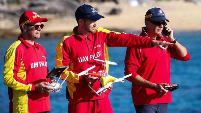 UAV pilots Michael Lette, Liam Byrne and James McLennan patrol Little Bay with drones. Picture: Gaye Gerard