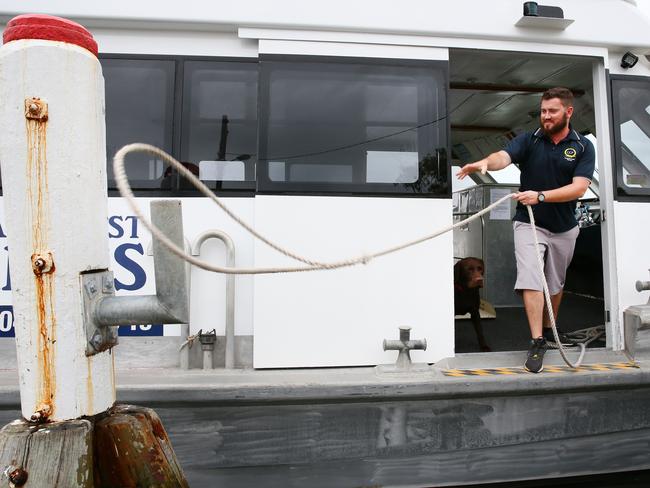 Tim Conway with his dog Milo, from Central Coast Ferries. Picture: Peter Clark