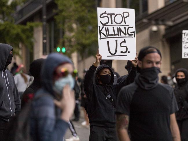 Demonstrators march at 5th Avenue and Marion Street in downtown Seattle to show solidarity with Minneapolis and protesting police brutality. Picture: AP