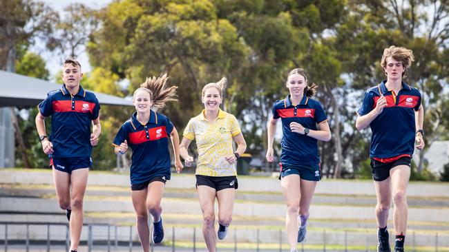 Stenson with young runners (L-R) James Bowling, Tessa Ebert, Jessica McManus and Jonathan Harris. Stenson said SA’s young group of athletes had a lot of promise. Picture: Tom Huntley