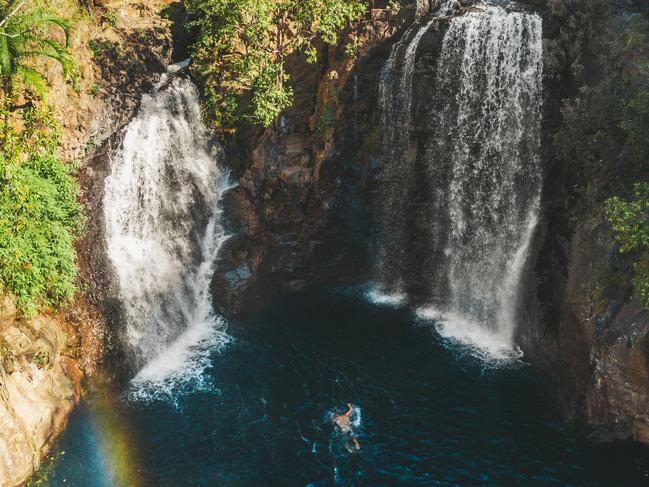 ESCAPE: Penny Carroll Top End highlights.Picture: Tourism NTAn aerial of visitors swimming in the plunge pool at Florence Falls.Get set for real adventure and to connect with nature at Litchfield National Park. At just over an hour from Darwin, it's every local's favourite day trip with its waterfalls and water holes, bush walks, four-wheel drive tracks, birds and wildlife.