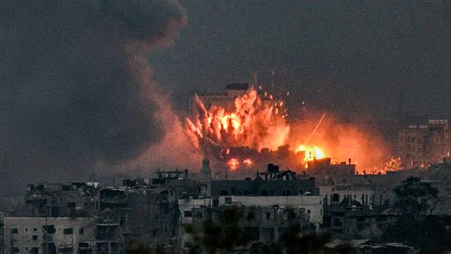 A fireball erupts during Israeli bombardment in the northern Gaza Strip on Saturday might. Picture: AFP