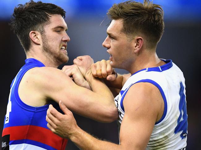 MELBOURNE, AUSTRALIA - JUNE 23:  Bailey Williams of the Bulldogs and Shaun Higgins of the Kangaroos push each other during the round 14 AFL match between the Western Bulldogs and the North Melbourne Kangaroos at Etihad Stadium on June 23, 2018 in Melbourne, Australia.  (Photo by Quinn Rooney/Getty Images)