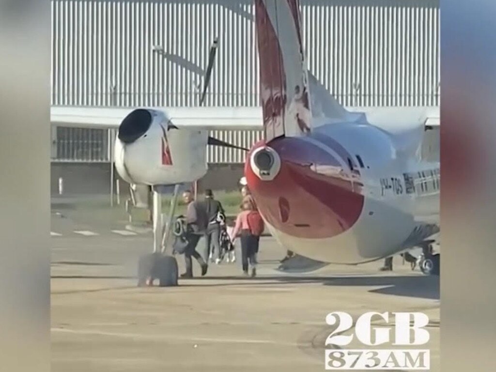 The plane catches fire after landing. Picture: 2GB